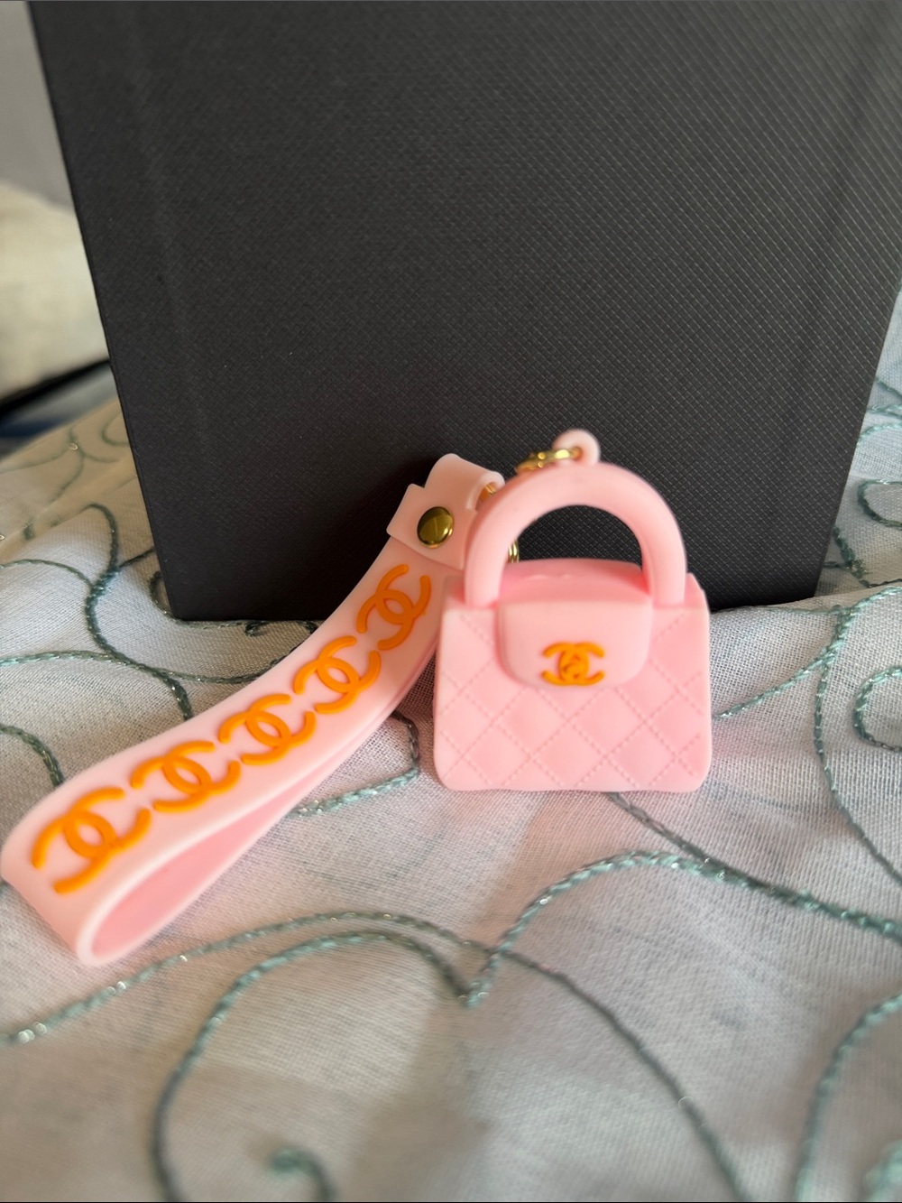 Pink Quilted Mini Handbag Keychain with Orange Logo Strap